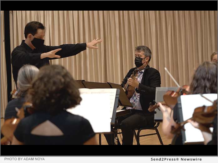 Lowell Chamber Orchestra music director Orlando Cela (left), and mandolinist Joseph Brent (right). Photo by Adam Noya